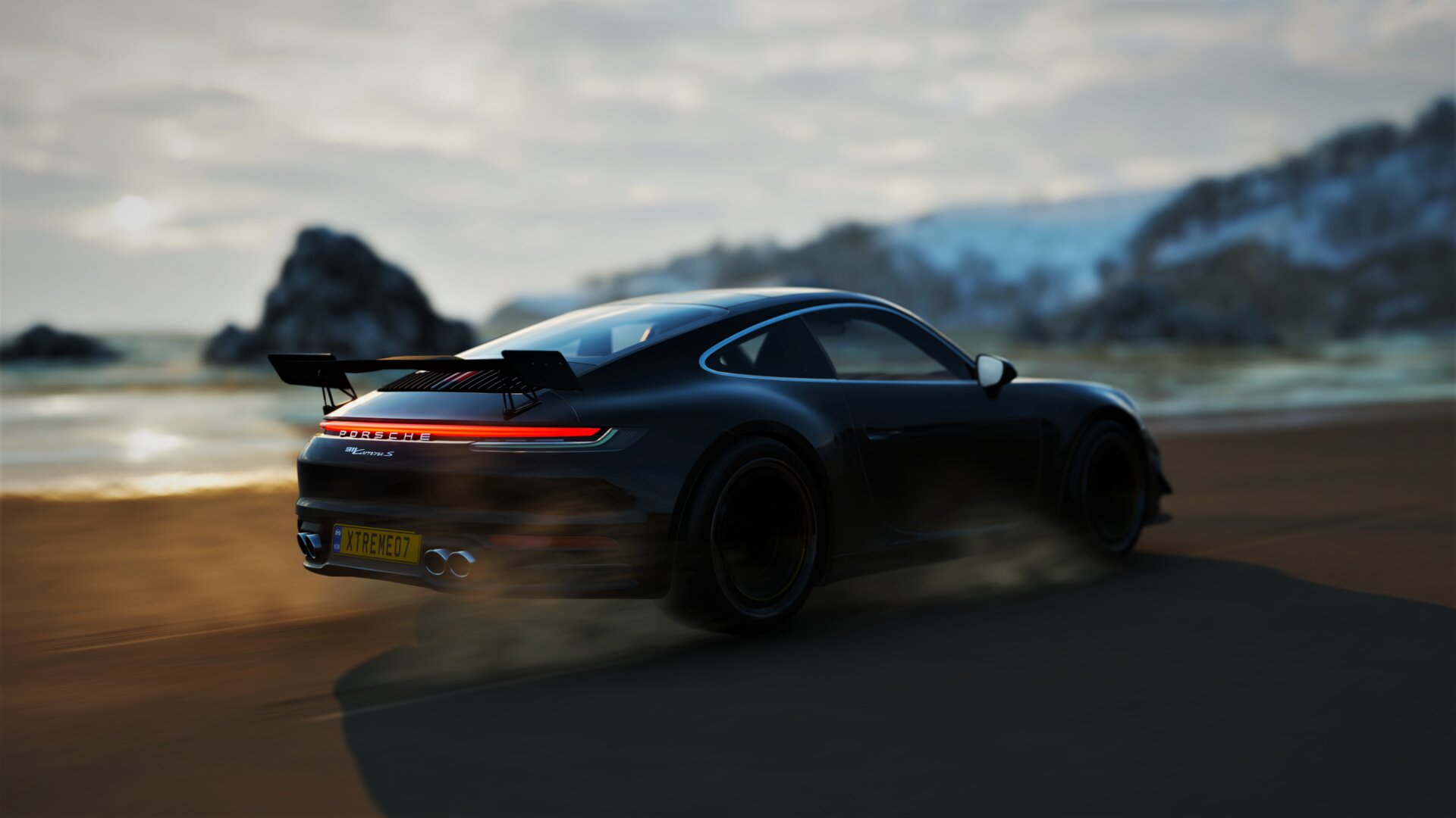 A Porsche 911 Turbo S at dusk.